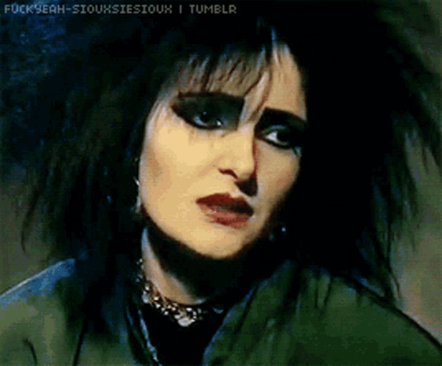 a close up of a woman 's face with the words " fuckyeah-siouxsiesioux i tumblr " on the bottom