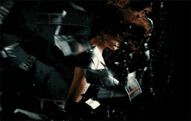 a woman in a black dress is surrounded by money that is falling from the sky