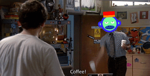 a man holding a cup of coffee talks to another man with a green monkey on his head