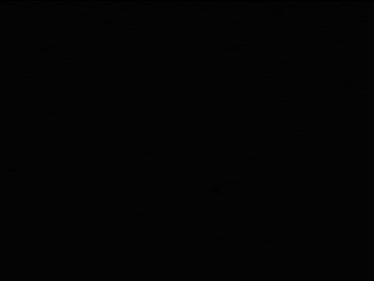 a close up of a yellow object in the dark