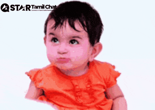 a baby is sitting in front of a star tamil chat banner