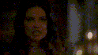 a blurred image of a person behind a glass door