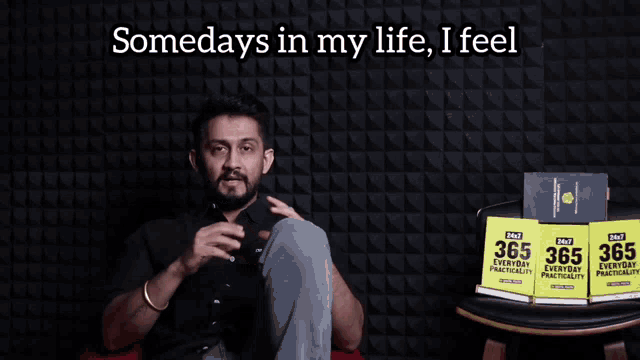 a man sits in front of a wall with the words somedays in my life i feel