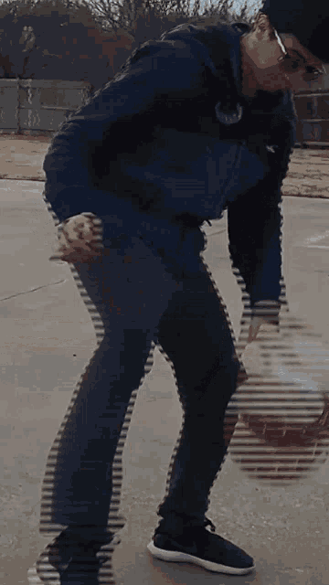 a blurry picture of a man playing basketball