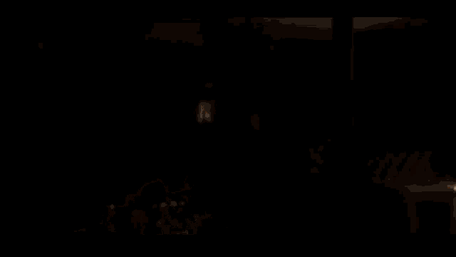 a woman with curly hair is wearing a fur coat in a dark room and says `` i 'm back '' .