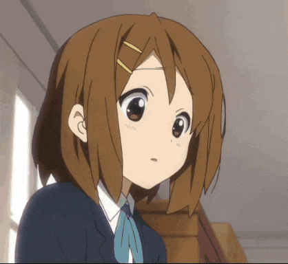 a close up of a girl 's face with brown hair