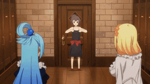 a girl in a black dress stands in front of a wooden door