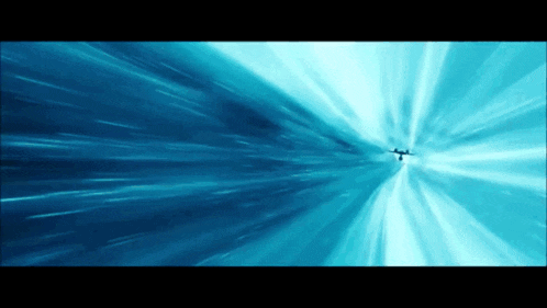 a plane is flying through a blue light
