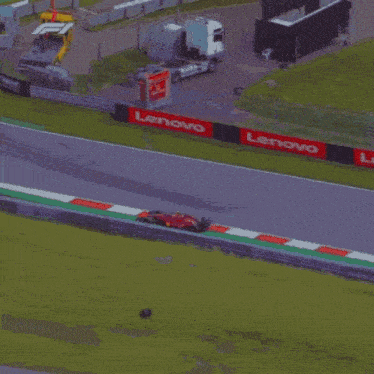 a red race car with the number 75 on the front