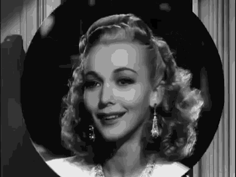 a black and white photo of a woman in a circle .