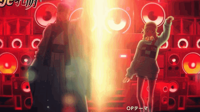 a man and a woman are dancing in front of a wall of speakers with the word op written on it