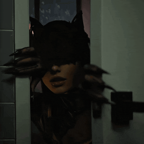 a woman in a cat costume is looking through a door