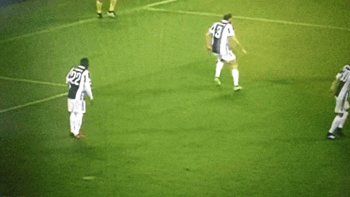 a group of soccer players are on a field and one of them has the number 17 on his jersey