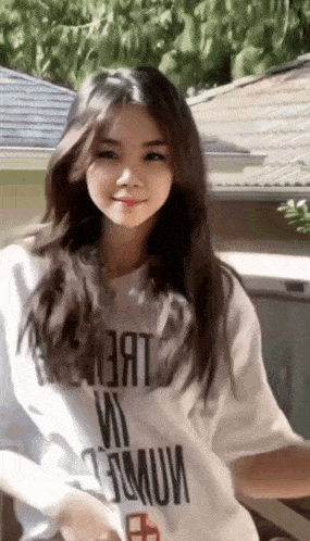a woman wearing a white t-shirt that says " premium " on the front