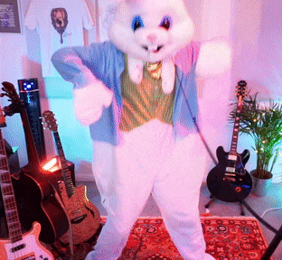 a person dressed in a bunny costume is standing in a room surrounded by guitars