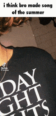 a person wearing a shirt that says day nights on it