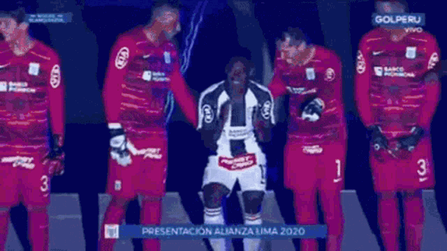 a group of soccer players are standing in front of a screen that says presentación alianza lima 2020