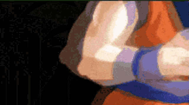 a pixelated image of a person 's arm with a black background .