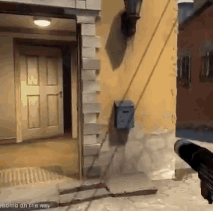 a person holding a gun in front of a building with the words " bomb off the way " on the bottom right