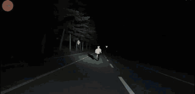 a man is laying on the ground in a dark room with a lot of lights .