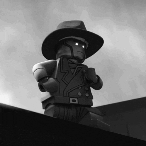 a black and white image of a lego man in a suit and hat