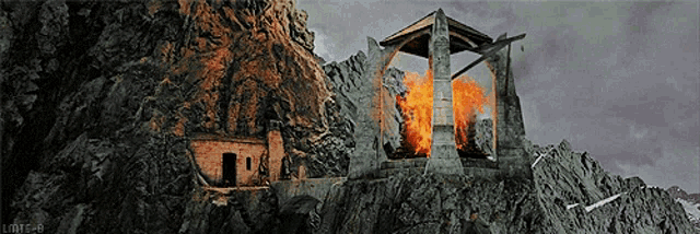 a castle on top of a mountain with fire coming out of the tower