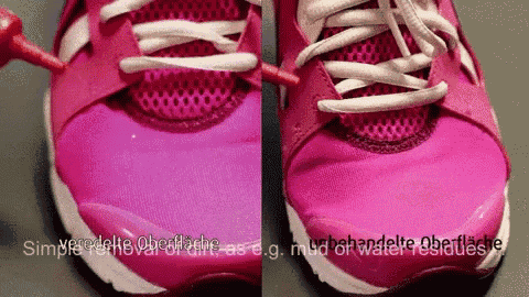 a pair of pink shoes being painted with a brush