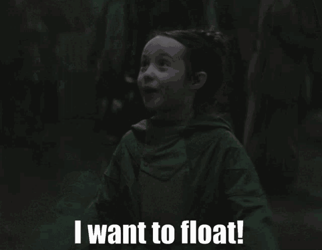 a man in a green hoodie is saying i want to float