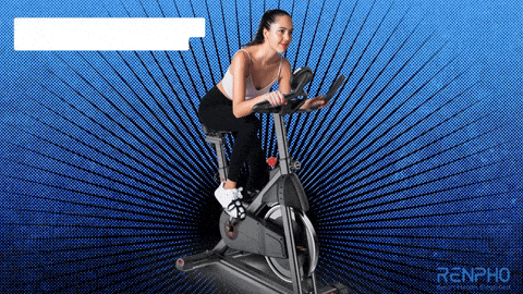 a woman is riding an exercise bike with the word renpho on the bottom right