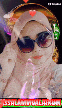 a picture of a woman wearing sunglasses and a hijab with the words " issalammualaikum "
