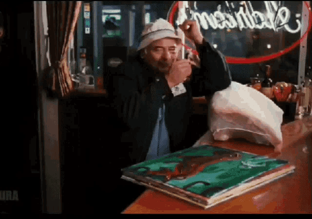 a man sitting at a bar with a sign that says " impossible "