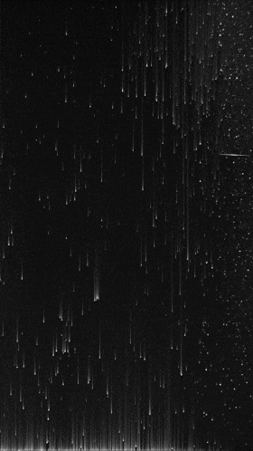 a black background with a lot of lines coming down it