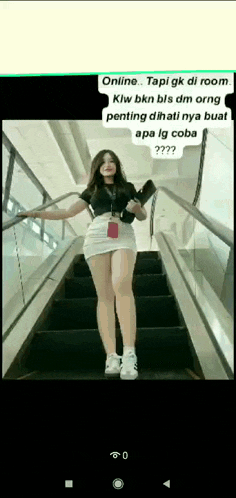 a woman in a short skirt is standing on a set of escalators with a text message behind her .