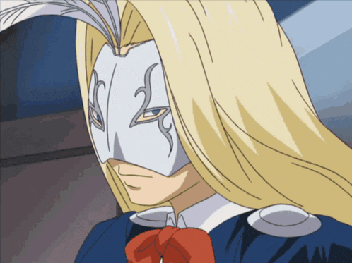a man with long blonde hair wearing a mask
