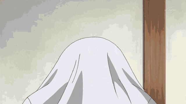a white cloth is covering a person 's face and says tokyo on the bottom right