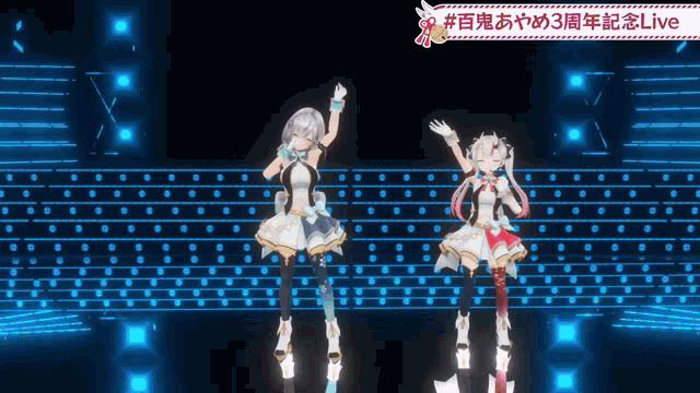 two anime girls are dancing on a stage with a sign that says live on it