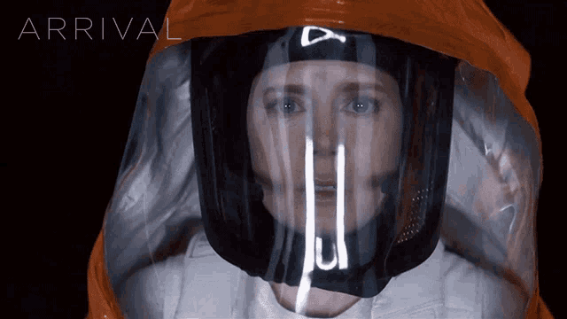 a woman wearing a helmet with a letter a on it