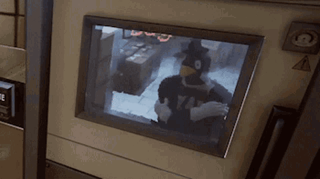 a screen with a picture of a man in a yale uniform