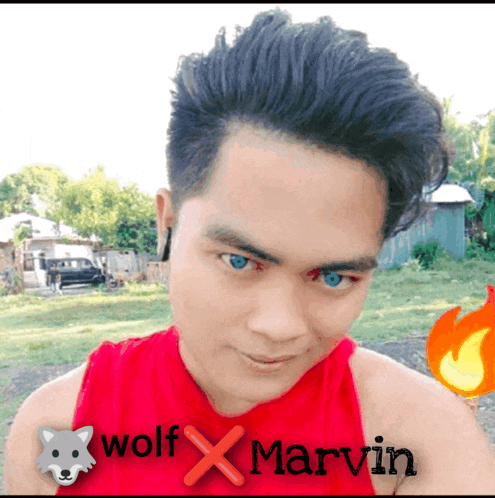 a man wearing a red shirt that says wolf x marvin on it