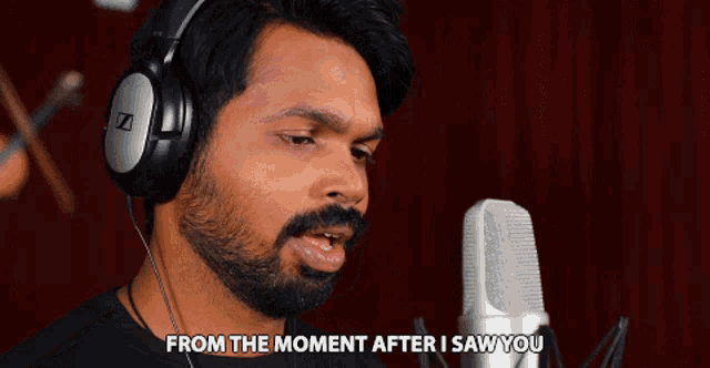 a man wearing headphones singing into a microphone with the words from the moment after i saw you above him