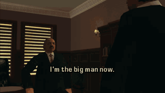 a man in a suit and tie says i 'm the big man now in a video game