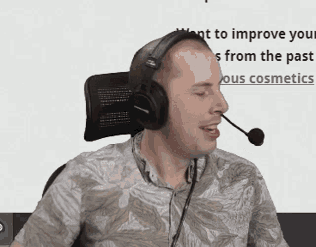 a man wearing headphones and a microphone says he wants to improve his cosmetics