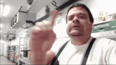a man giving the middle finger in front of a king gold box