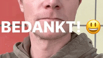 a man with a beard is taking a selfie with the words bedankt written on his face .