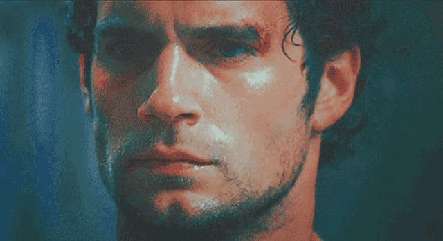 a close up of a man 's face with blood on his face