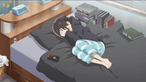 a person is laying on a bed with a clock that says 10:08