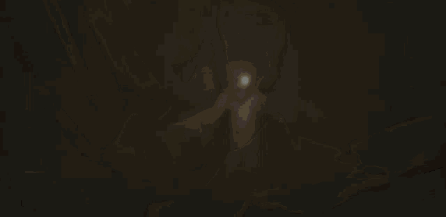 a close up of a doll 's face with a light coming out of it 's eyes .