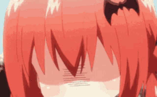 a close up of a person 's face with red hair and a bat on their head .