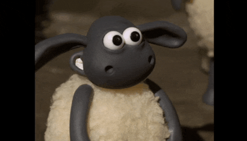 a close up of a cartoon sheep with a surprised look on his face