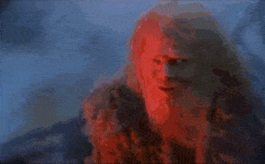 a close up of a person 's face with a red background